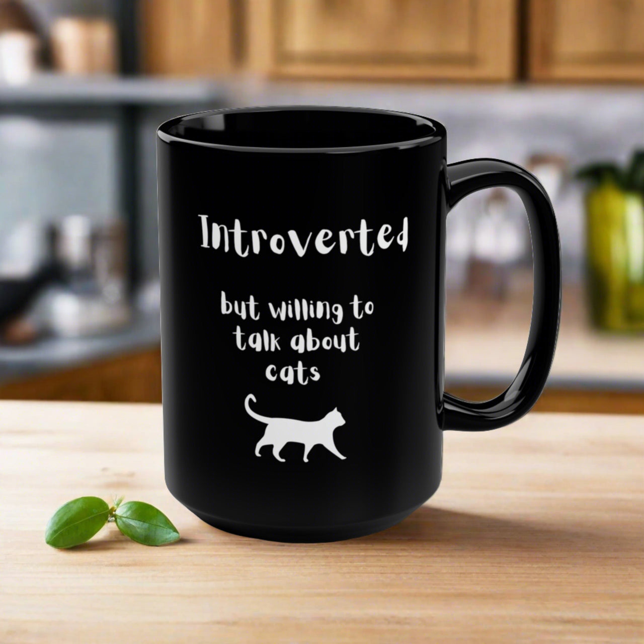 Funny black cat coffee mug with text that says Introverted but willing to talk about cats