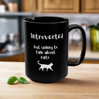 Thumbnail for Funny black cat coffee mug with text that says Introverted but willing to talk about cats