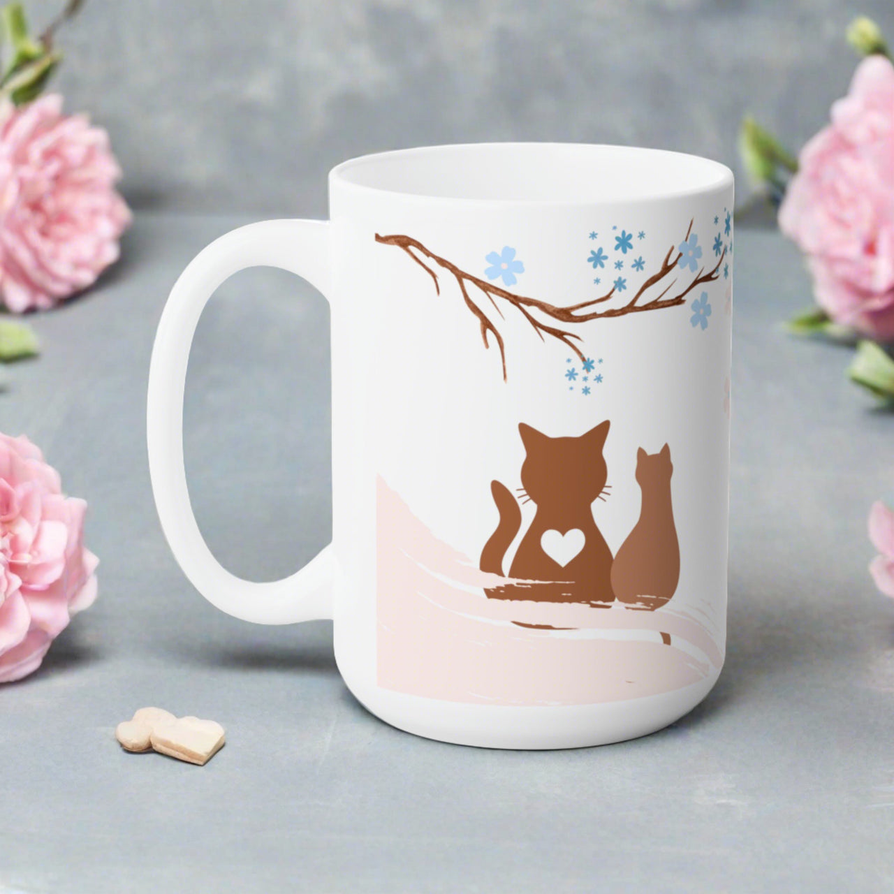 beautiful white cat mug with printed paint art. Two brown cats with heart under a blue flowering tree.