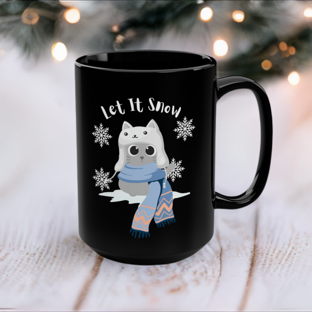 Cute Christmas cat mug with image of cat in the snow with the text "let it snow"